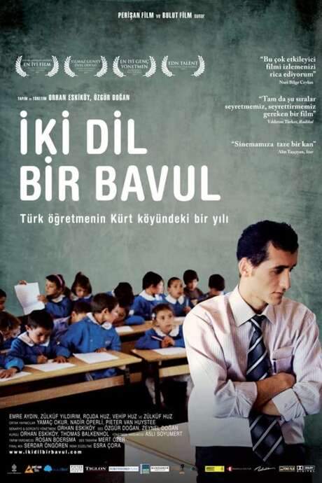 The documentary follows a Turkish teacher during a school year (Sept 2007‑June 2008) as he teaches Turkish to Kurdish children in a remote village. Neither side speaks the other's language, making the teacher feel like an exile in his own country. Over months they gradually bridge the communication gap, revealing the loneliness of an outsider and the subtle cultural shifts his presence brings.